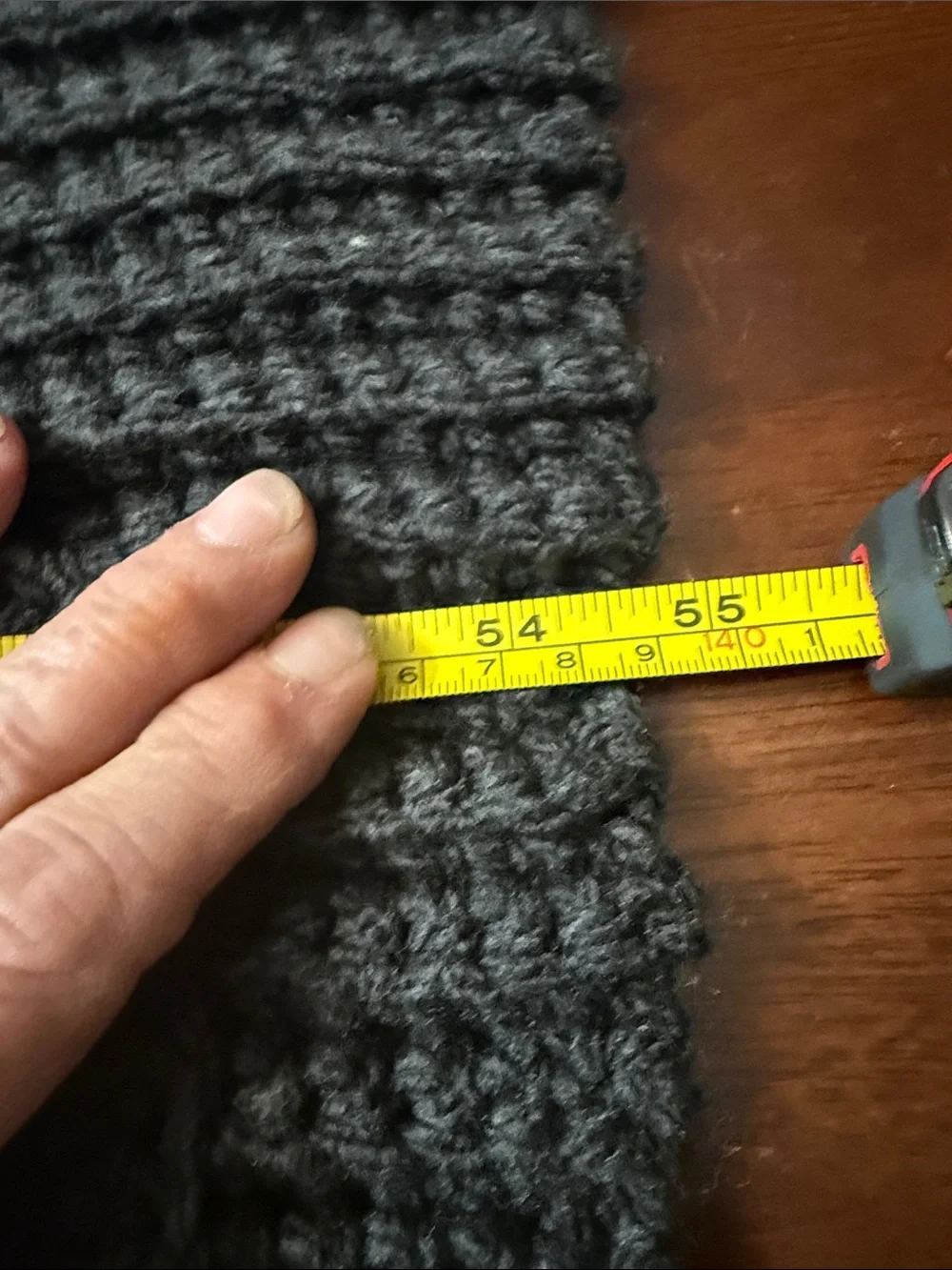 Artisan Black Ribbed Knit Throw Blanketwith pockets for storing things on couch